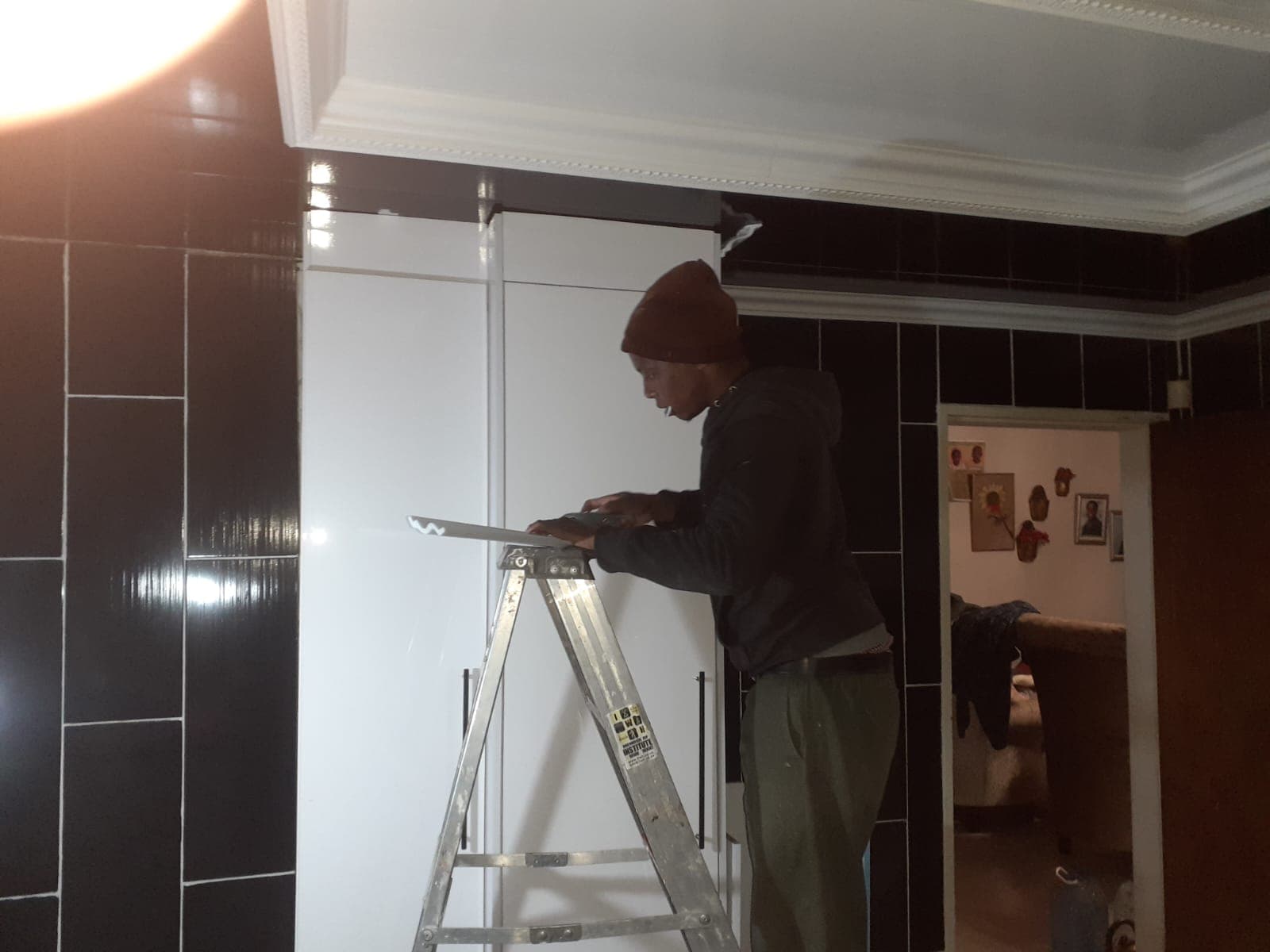 Expert carpenter carefully finishing a piece of custom cabinetry
